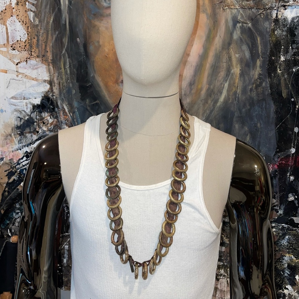 Very unique African inspired brass and leather necklace. Heavy and masculine